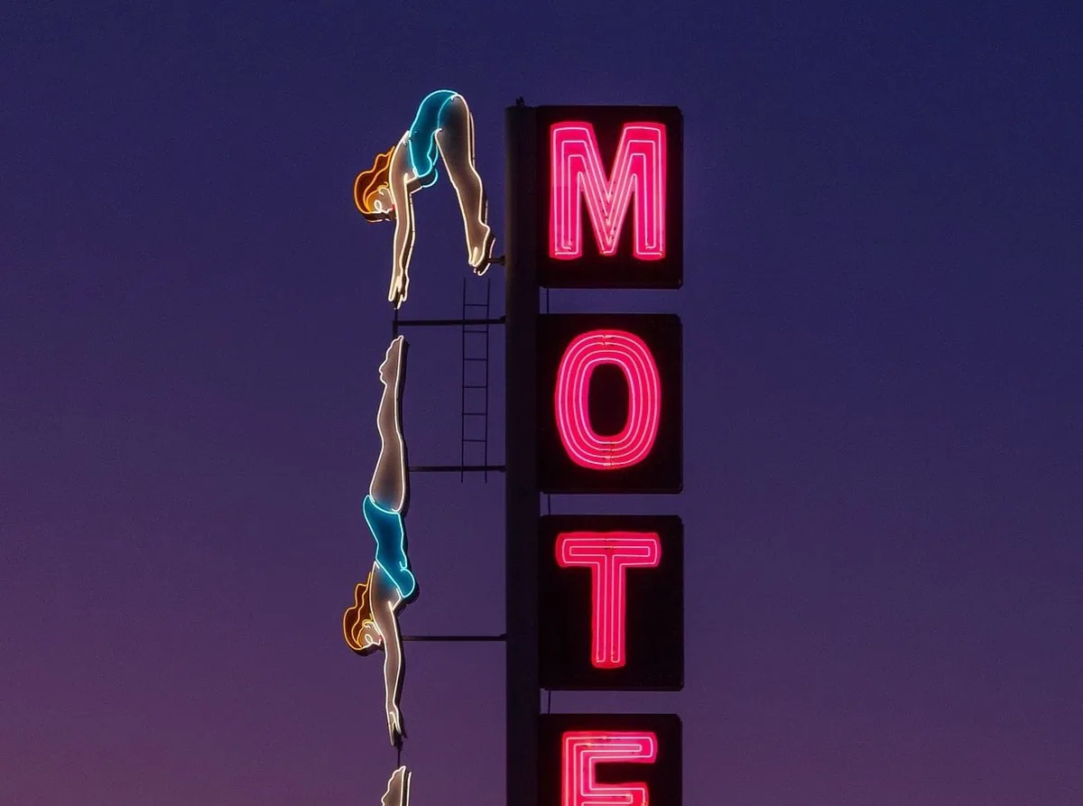 A photo of a sign and the vector made from it. Drag the handle.